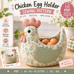 May include: A sewing pattern for a chicken egg holder featuring a sage green fabric with a white and pink floral print. The chicken-shaped holder has a pink comb and wattle, a yellow beak, and a sage green polka dot wing. It holds several brown eggs.