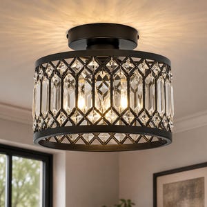 May include: A semi-flush mount ceiling light fixture featuring a cylindrical black metal frame with a diamond-patterned lattice design. The frame is inset with clear, vertical rectangular glass crystals that refract light from internal bulbs.