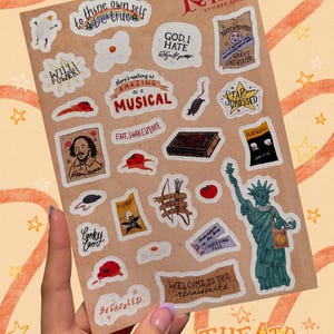 May include: A sticker sheet featuring various illustrations and text related to the musical Something Rotten, including a portrait of William Shakespeare, the Statue of Liberty, a book, tomatoes, and phrases like to thine own self be true.