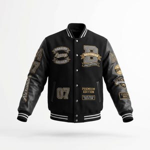 May include: A black varsity jacket with leather sleeves, featuring white and gold embroidered patches including the text Varsity Legacy, Brothers Unstoppable, Premium Edition, Black Friday Collection, Alexander, 07, and Custom Build.