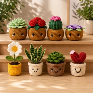 May include: A collection of eight crocheted potted plants with embroidered faces. The set includes various succulents, a daisy, a cactus, and red flowers in brown, yellow, and cream-colored yarn pots, arranged on a tiered wooden surface.