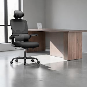 May include: A black office chair featuring a mesh backrest, a headrest, adjustable armrests, and a cushioned seat. The chair is supported by a five-point base with rolling casters, providing mobility and stability for a workspace environment.