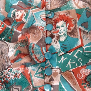 May include: A turquoise and brown patterned fabric with a row of turquoise buttons down the center. The fabric features a variety of abstract designs, including playing cards, figures, and text.