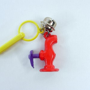 True Vintage Plastic Bell Charm Red Purple Water Faucet Spigot Kitsch 80s Nostalgic Fad