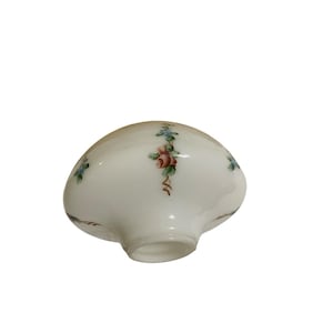 May include: A white, dome-shaped glass lamp shade featuring a hand-painted floral motif. The design includes small pink roses with green leaves and delicate blue accents arranged in vertical patterns around the smooth, translucent surface.