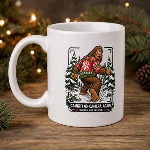 Bigfoot Christmas mug, funny trail cam stocking stuffer, cryptid holiday coffee mug, ugly sweater sasquatch gift