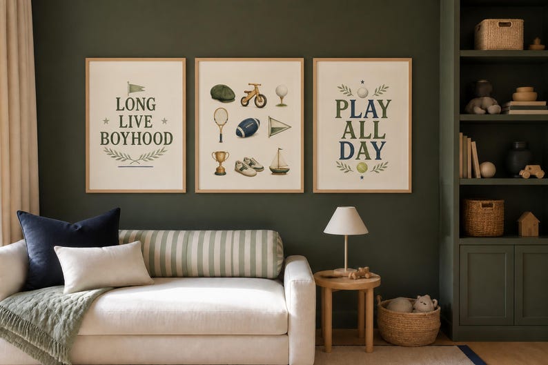 May include: Three framed wall art prints with light wood frames. The left print features the text LONG LIVE BOYHOOD. The center print displays illustrations of a cap, bicycle, golf tee, tennis racket, football, pennant, trophy, shoes, and sailboat. The right print says PLAY ALL DAY.