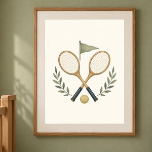 May include: A framed wall art print featuring two crossed wooden tennis rackets with dark blue grips, a single yellow tennis ball, a small green flag, and two symmetrical green leafy branches on a cream-colored background inside a wooden frame.