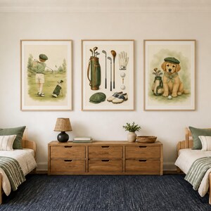 May include: Three framed wall art prints featuring golf-themed illustrations. The left print shows a person golfing, the center print displays golf equipment including a bag, clubs, and shoes, and the right print depicts a puppy wearing a golf cap.