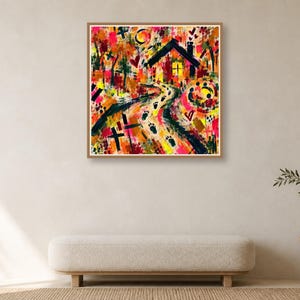 A square abstract painting in a thin wooden frame displayed on a neutral wall above a long upholstered beige bench and a small side table with a vase.
