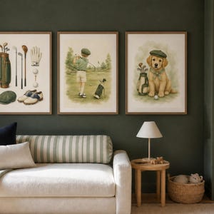 May include: Three framed wall art prints featuring golf-themed illustrations. The first print displays golf equipment including a bag, clubs, glove, balls, and shoes. The second shows a person golfing. The third depicts a puppy wearing a green cap.