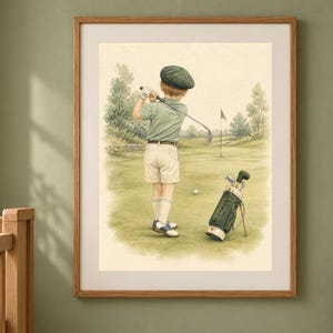 May include: A framed wall art print featuring a watercolor illustration of a young golfer in a green cap, polo shirt, and beige shorts swinging a golf club on a green course, with a golf bag standing nearby on the grass in a soft, muted palette.