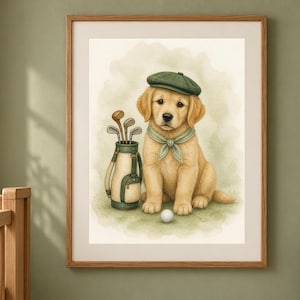 May include: A framed watercolor illustration of a golden retriever puppy wearing a green flat cap and a matching green neckerchief. The puppy sits next to a golf bag filled with clubs and a single white golf ball on a soft green grassy surface.