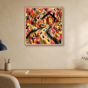 A square framed abstract painting centered on a beige wall above a wooden desk holding a black desk lamp, a pencil holder, a notebook, and a potted plant.