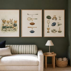 May include: Three framed wall art prints featuring illustrations of animals in sports attire, various sports equipment including a tennis racket, football, and baseball bat, and a collection of vintage-style sports gear like a trophy and sailboat.
