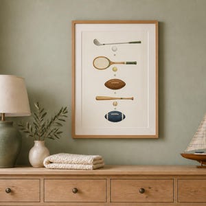 May include: A framed vertical wall art print featuring a series of vintage sports equipment illustrations, including a golf club, tennis racket, football, baseball bat, and a blue football, arranged in a column on a light cream background.