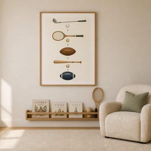 May include: A framed vertical wall art print featuring a series of sports equipment illustrations including a golf club, tennis racket, football, baseball bat, and rugby ball, arranged in a column with small balls between each item on a white background.