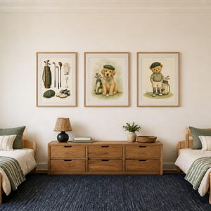 May include: Three framed wall art prints featuring golf-themed illustrations, including a set of golf clubs and accessories, a golden retriever puppy wearing a green cap, and a teddy bear dressed in golf attire, all displayed in a bedroom setting.