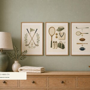 Three vertical framed prints depicting crossed golf clubs, tennis equipment, and golf balls displayed above a wooden cabinet.
