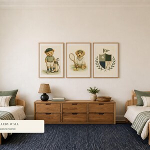 Three framed sports prints featuring teddy bears and a club crest hang centered above a wooden dresser between two twin beds.