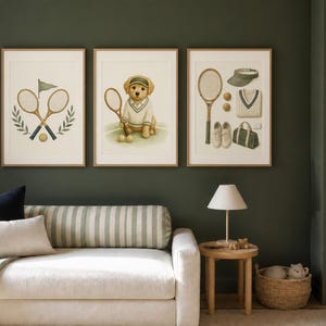 May include: Three framed wall art prints featuring tennis-themed illustrations. The left print shows crossed tennis rackets and a flag. The center print depicts a puppy wearing a visor and sweater. The right print displays tennis gear including a racket, visor, sweater, shoes, and a bag.