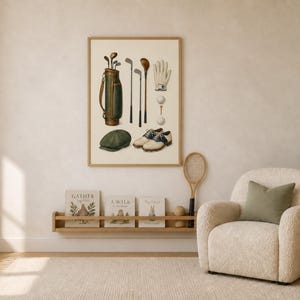 May include: A framed wall art print featuring a vintage golf illustration. The artwork displays a dark green golf bag with clubs, a white glove, two golf balls on tees, a pair of white and brown golf shoes, and a dark green flat cap hat.