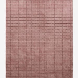 May include: A rectangular area rug in a dusty rose color featuring a uniform grid pattern of small, raised square tufts across the entire surface. The rug has a soft, textured appearance with consistent spacing between each square segment.