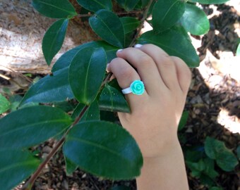 Kids aqua petite flower adjustable ring by PuffyCheeks