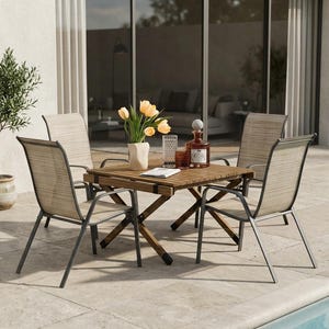 May include: A patio dining set featuring a square wooden table with a slatted top and four chairs with dark metal frames and beige mesh fabric seats and backrests. A white vase with yellow tulips, a glass, and a bottle sit on the table.