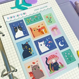 May include: A sheet of colorful paper cat club stamps with different cat illustrations and designs. The stamps feature a variety of themes, including mushrooms, flowers, and stars. The stamps are labeled with different values, such as 10, 25, and 50.