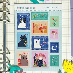 A sheet of A6 matte stickers featuring cats amongst wildflowers in a stamp-like design.