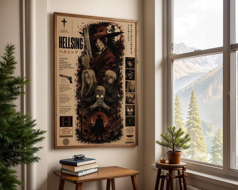 May include: A framed Hellsing anime poster featuring a dark, detailed illustration of characters including Alucard in a red hat and coat, with Japanese and English text, displayed on a wall above a wooden table with stacked books.