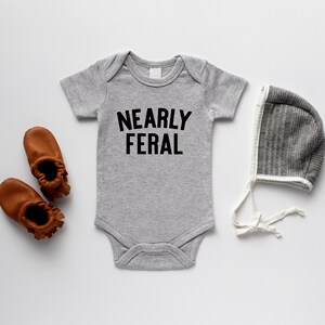 Nearly Feral Organic Baby Bodysuit • Funny Wild Child GOTS Certified Baby Outfit • Gender Neutral Unique Hand-Printed Bodysuit in Gray