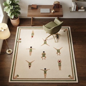 May include: A rectangular area rug with an off-white base and a dark green and brown border. The rug features a repeating pattern of figures wearing green swimsuits and red swim caps in various swimming and diving poses across the surface.