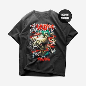May include: A charcoal gray short-sleeve t-shirt featuring a graphic print of piranhas with sharp teeth, red accents, and bubbles. The text EXODUS appears in a stylized font at the top, with PIRANHA below. A circular logo reads MOSHPIT APPARELS.