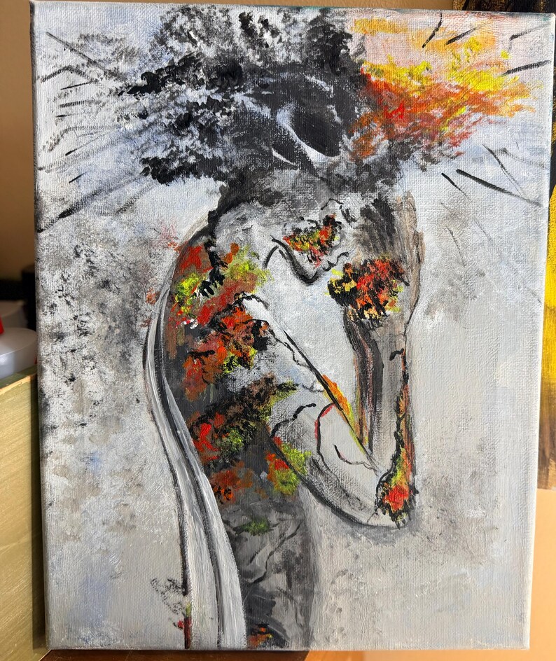 May include: An abstract painting on canvas depicting a figure with a head of dark, textured black paint. The body is rendered in shades of gray with vibrant patches of red, orange, and yellow paint, creating a stark contrast against the light gray background.