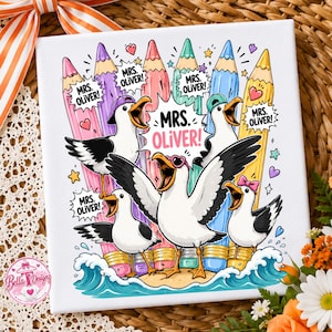 May include: A square canvas print featuring five cartoon seagulls with open beaks, standing on a small sandy island amidst blue waves. Behind them are five colorful pencils. The text MRS. OLIVER! appears in speech bubbles and center.