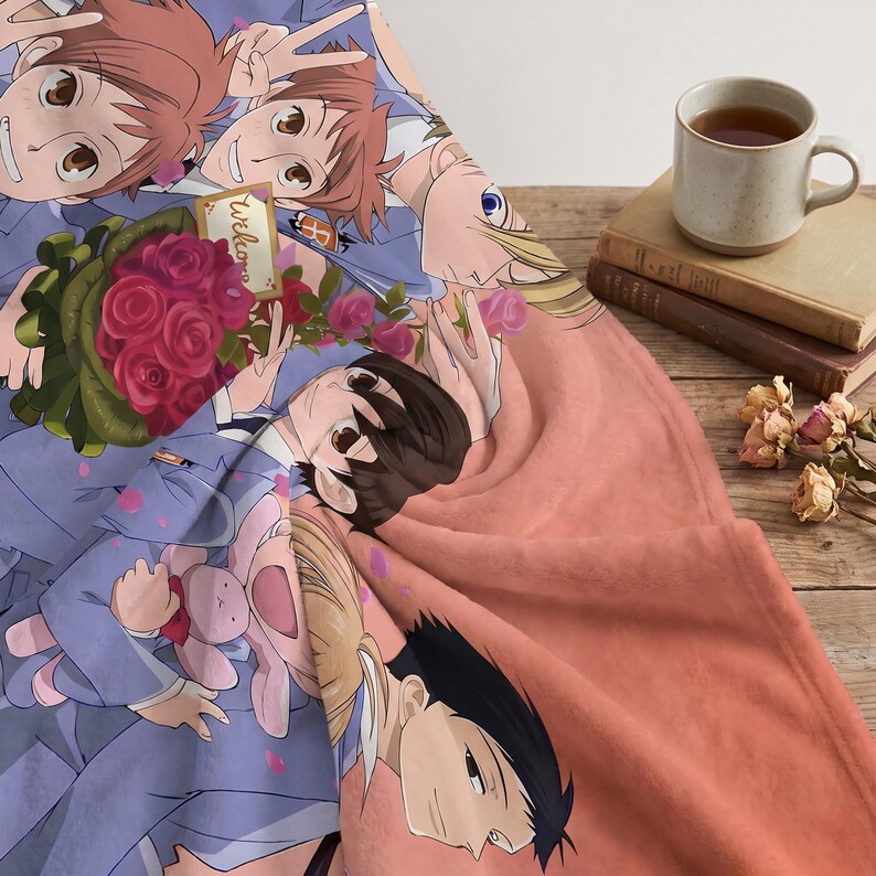 May include: A soft fleece blanket featuring a colorful anime-style illustration of multiple characters in blue uniforms, one holding a bouquet of red roses and a small pink rabbit plush toy, with the text Welcome printed on a small tag.