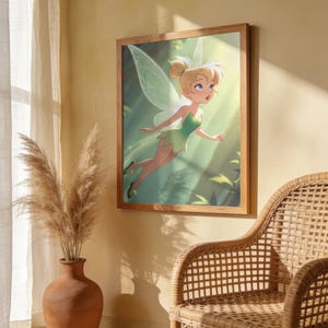 May include: A square framed wall art print featuring a digital illustration of a blonde fairy with a green dress and translucent wings, depicted in a forest setting with soft light rays. The artwork is displayed in a light wood frame.