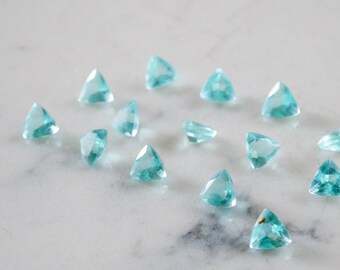 6mm faceted sky blue quartz gemtones. Trillion Shape gemstone.