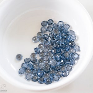 6mm ozeangrauer NANO rose facettierter Cabochon. Nano Edelstein Stahl blau grau cab.