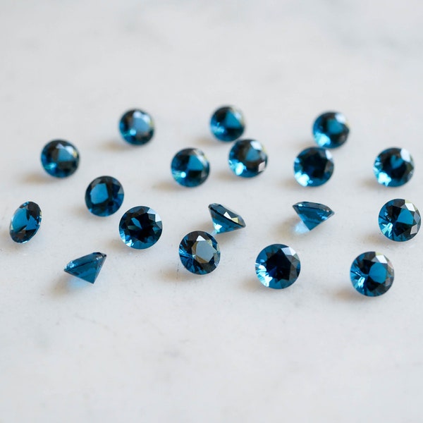 5mm london blue topaz faceted NANO gemstones. teal blue brilliant cut lab grown topaz