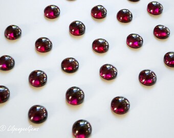 6mm red garnet smooth polished cabochon. ruby red. blood red. wine auburn deep red