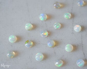 3mm ethiopian opal smooth cabochon. glowing radiant gemstone flashy opal cabs round gems