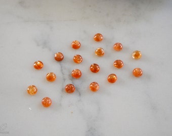 3mm sunstone cabochons. smooth polished orange sparkling cabs