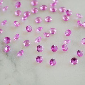 3mm lab pink sapphire gemstones. brilliant cut pink gems