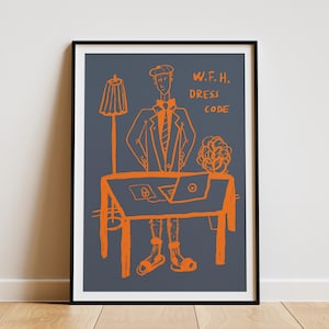 May include: A framed wall art print featuring a dark gray background with orange line art of a person wearing a blazer, tie, and sandals standing at a desk with a laptop. The text W.F.H. DRESS CODE is printed in orange on the right side.