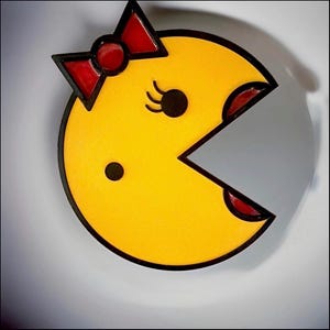 Ms Pac-Man collectible wall decor, sign