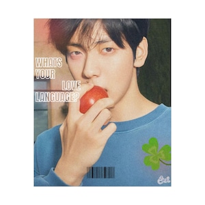 May include: A person with dark hair wearing a blue crewneck sweatshirt holds a red apple near their mouth. The text WHATS YOUR LOVE LANGUAGE? is printed in white on the left. A green clover graphic and a barcode are visible on the lower portion.
