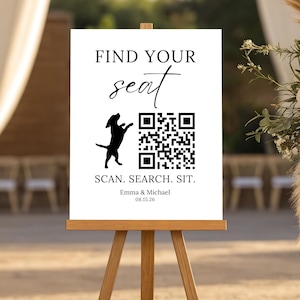 May include: A white rectangular wedding seating sign on a wooden easel featuring black text that reads FIND YOUR SEAT, a black silhouette of a dog, a QR code, the text SCAN. SEARCH. SIT., and the names Emma & Michael with the date 15.08.26.